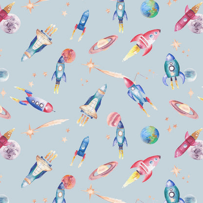 Pattern of colorful rockets and planets on a light blue background