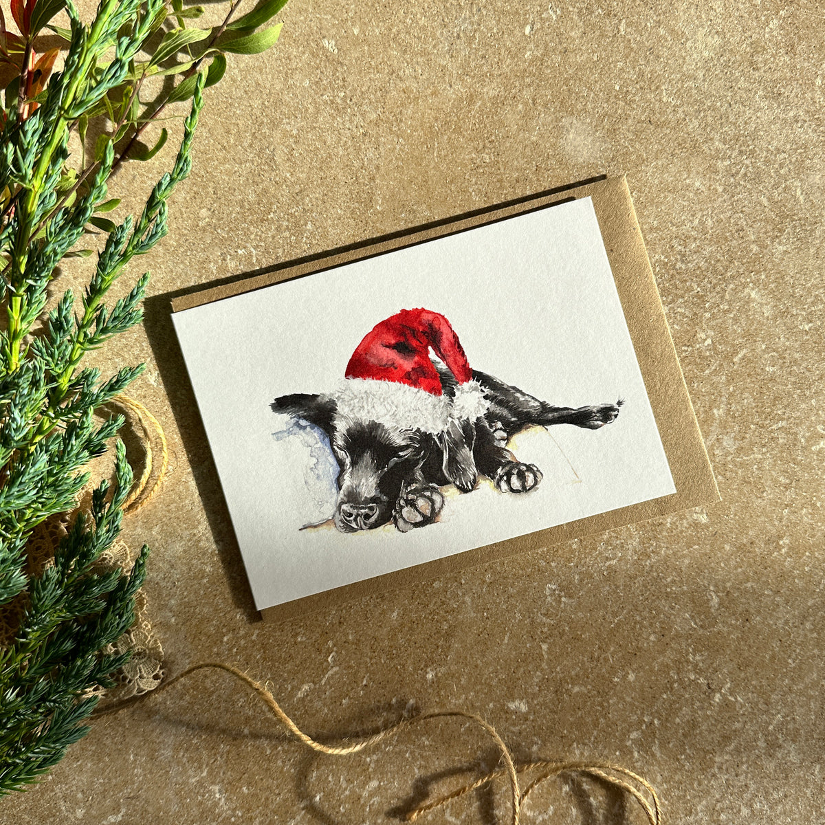 Sleeping Puppy in Santa Hat Christmas Card