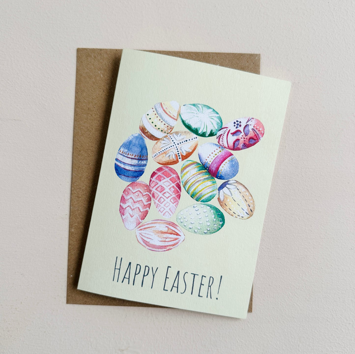 Easter greeting card with colorful eggs and 'Happy Easter!' text on a yellow background