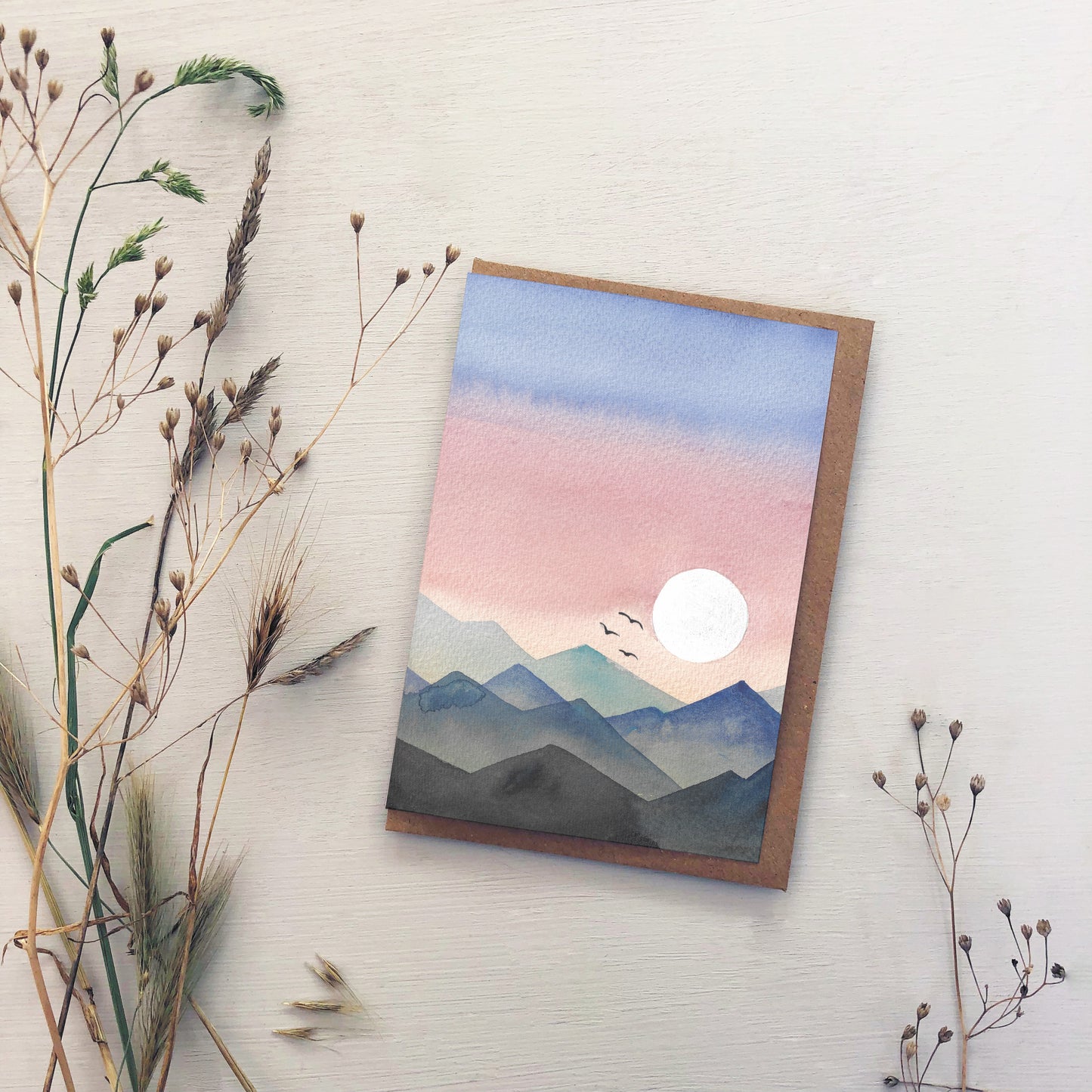 Watercolour Mountain Sunset Greeting Card – Layered Blue & Pink Landscape with Birds